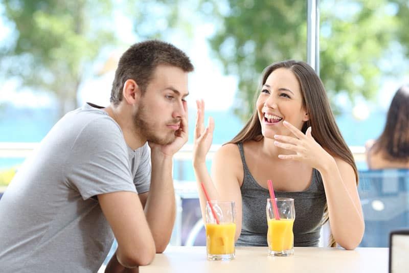 man ignoring woman talk