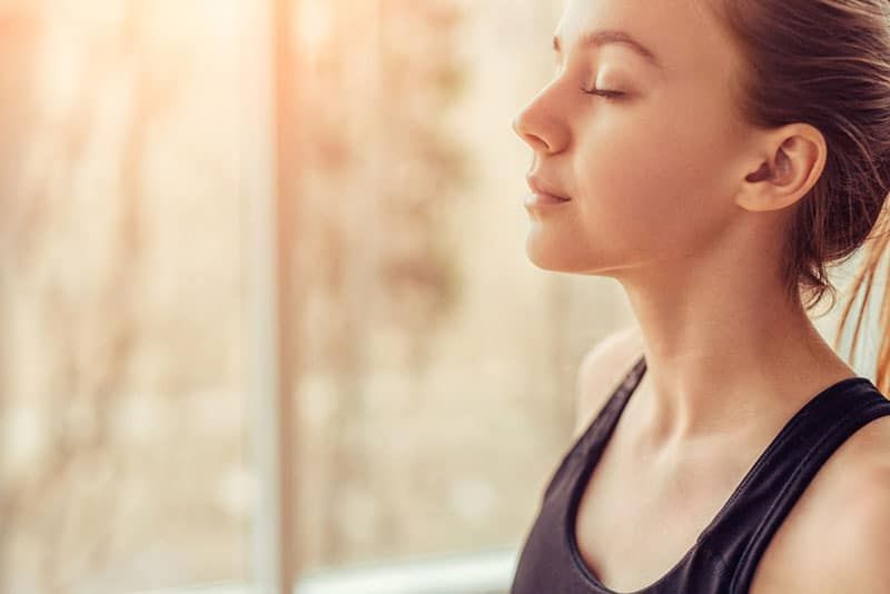 young woman breathing 