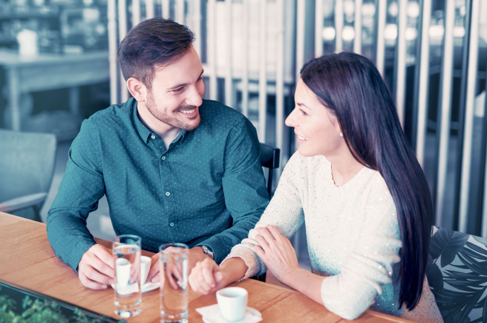 happy man and woman in a bar