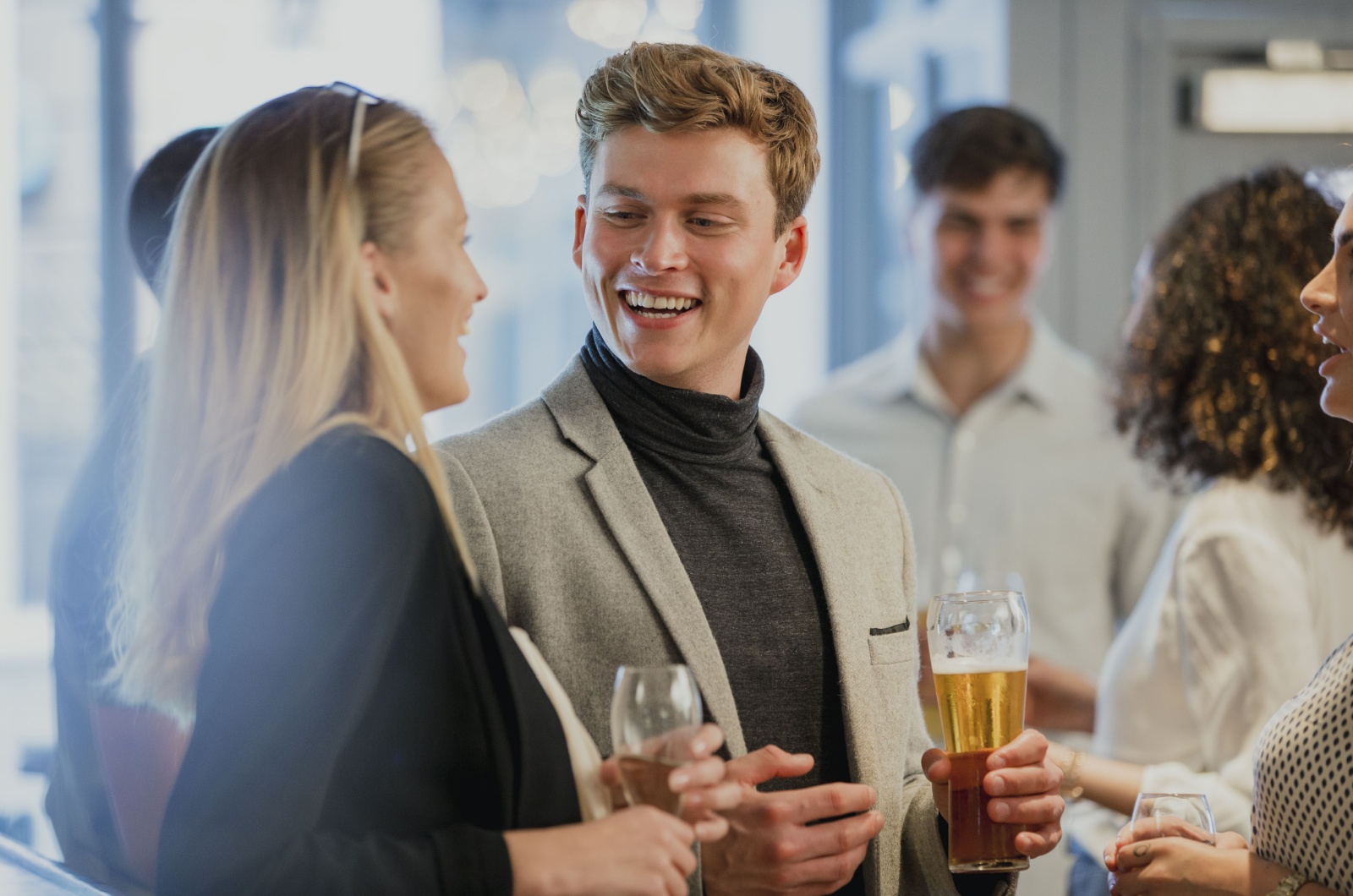 man and woman talking in a bar