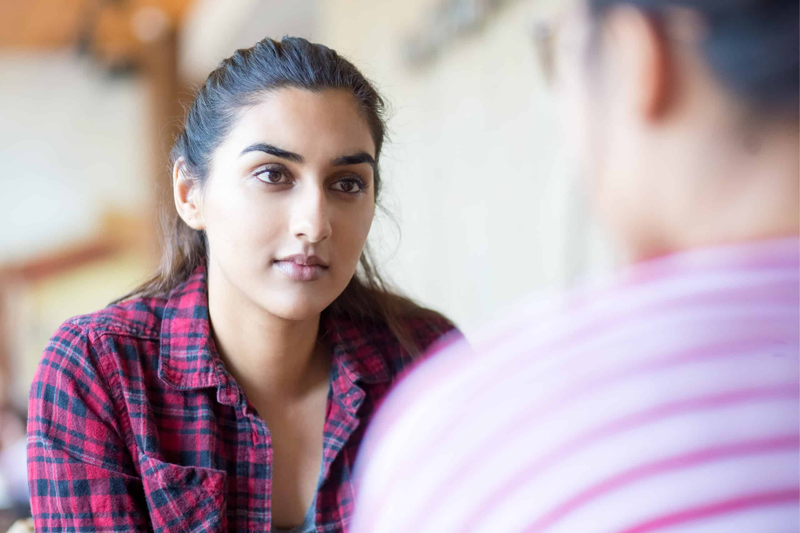 a woman talking to a friend