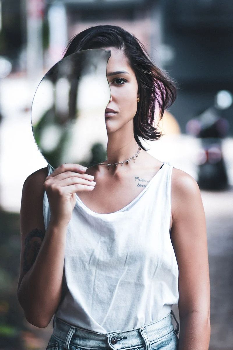 Woman in White Tank Top Holding A Broken Glass Over Her Face ...