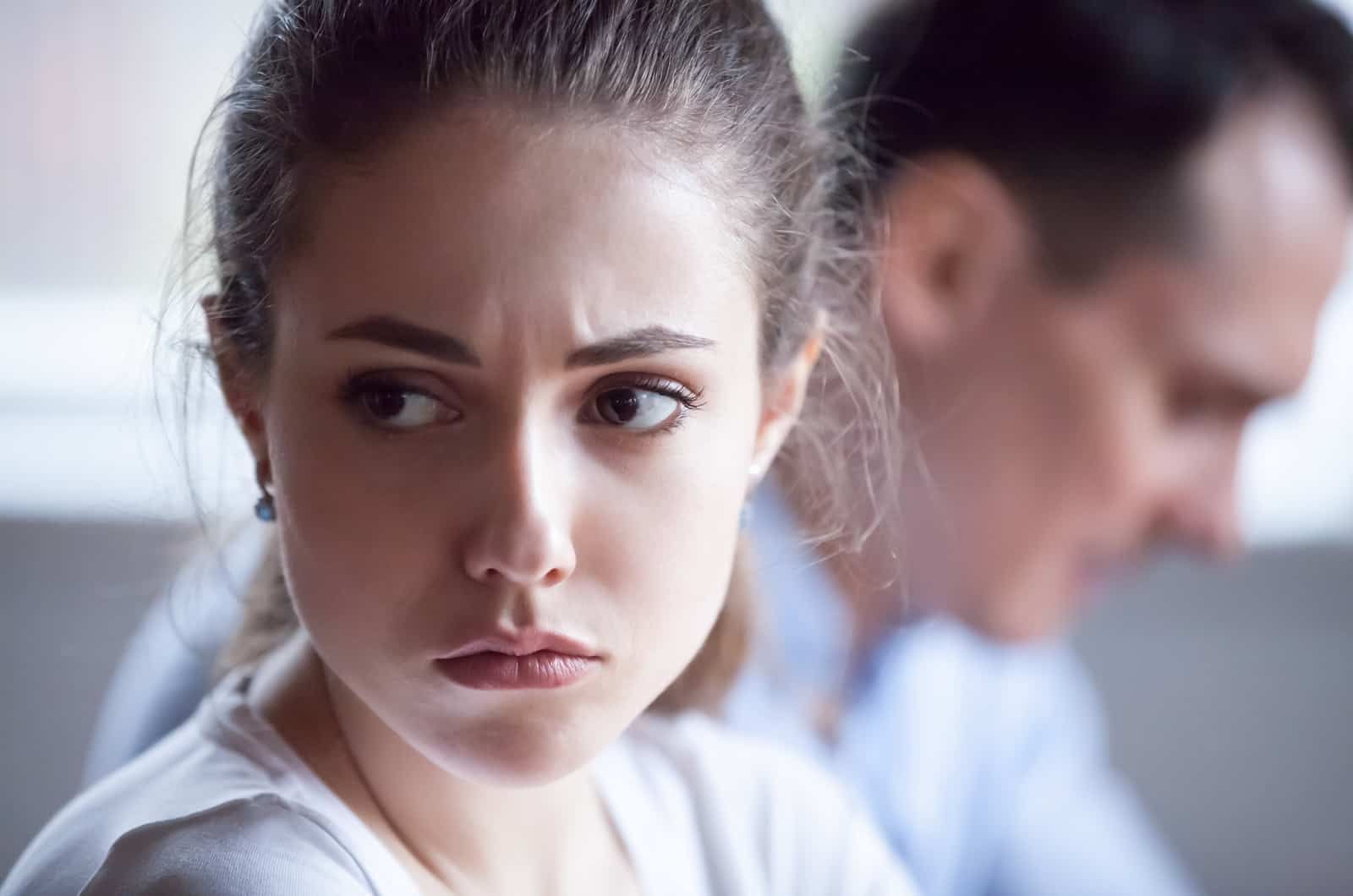 woman has a worried expression during a conversation