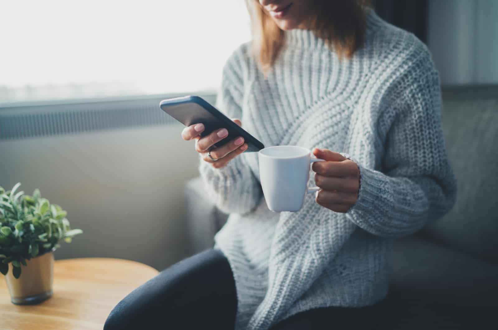 woman looking at phone