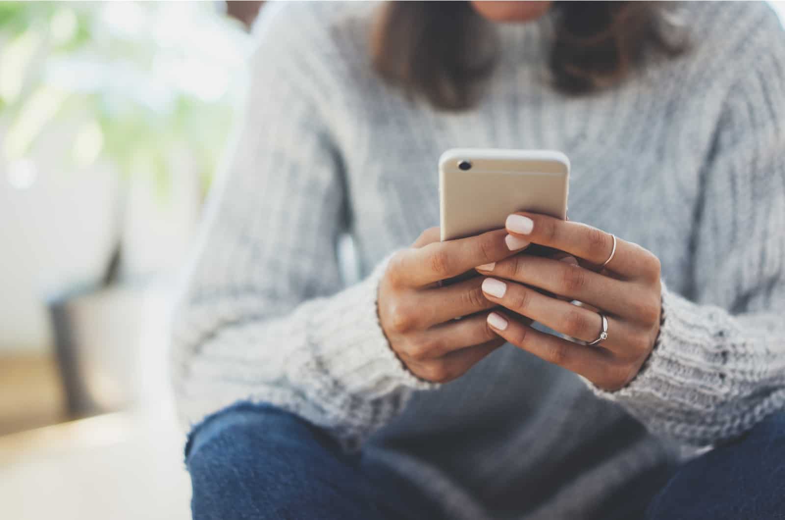 woman texting on phone